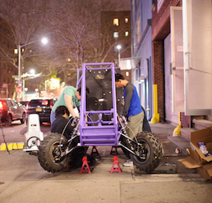 Team members apply the final touches to their all-terrain vehicle